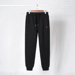 Black pants with red label